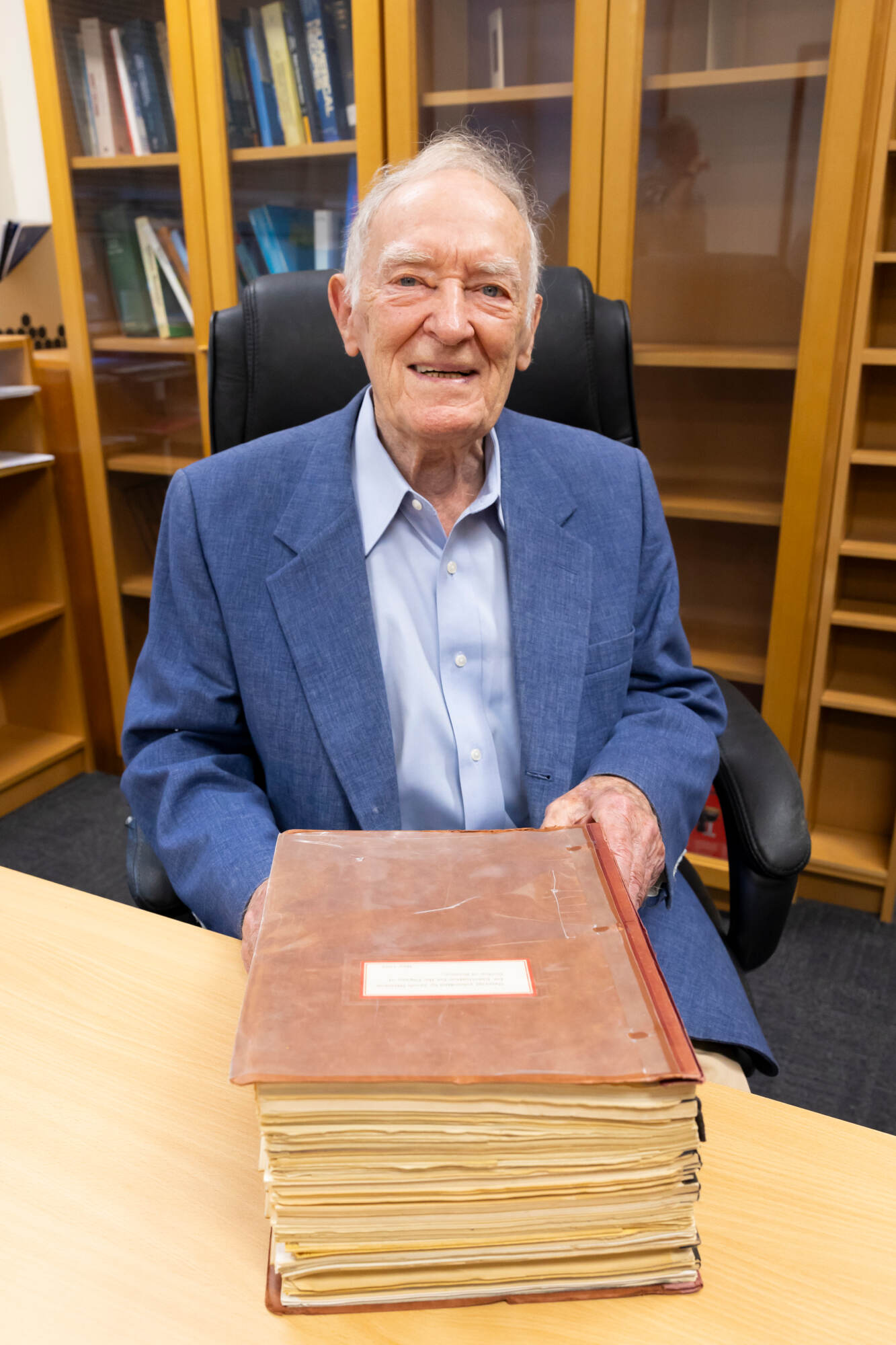 Dr Jacob Haimson with the large book he submitted in order to receive his prestigious Doctor of Science degree in 1967.