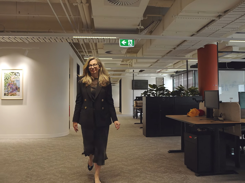 CEO of Expression Australia Rebecca Adam walking through the Melbourne office.