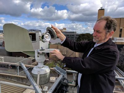Dr Ed Newbigin with pollen count machine at Parkville campus