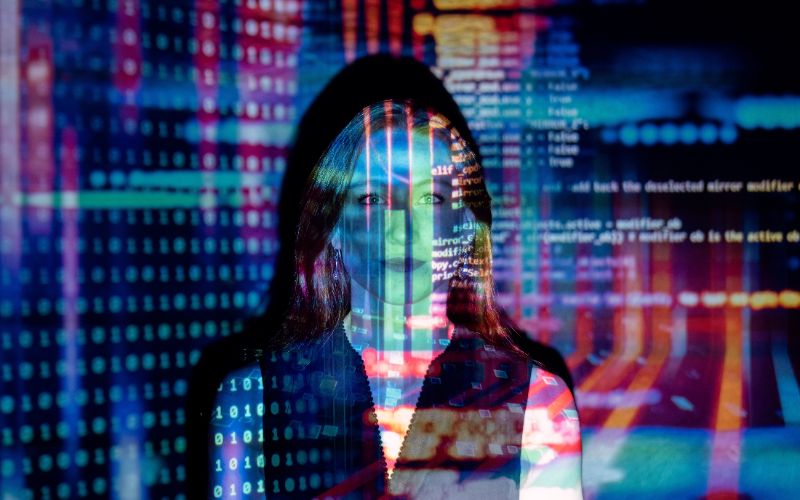 Image by Christina Morillo Woman behind a code script