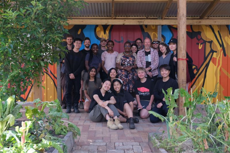Dr David O’Brien and CEO of Afri-Aus Care Selba Gondoza Luka (middle row, third and fourth from right) with architecture students and community members at the Springvale site.