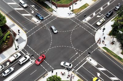Cars at an intersection in a residential environment