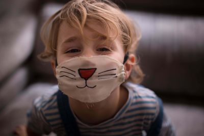 Young child with face mask
