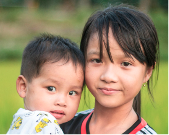 Image of a woman holding her child.