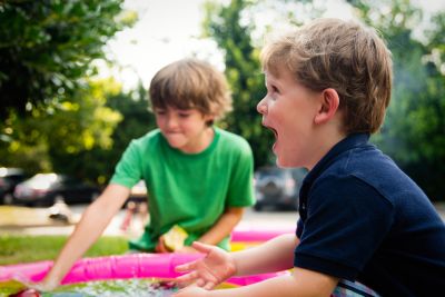 Two young boys playing outside