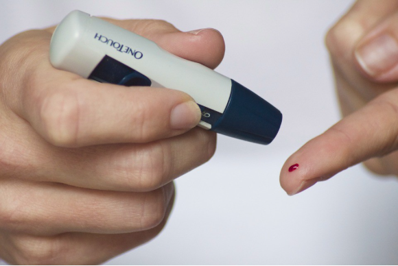 Image of a person checking their insulin levels.