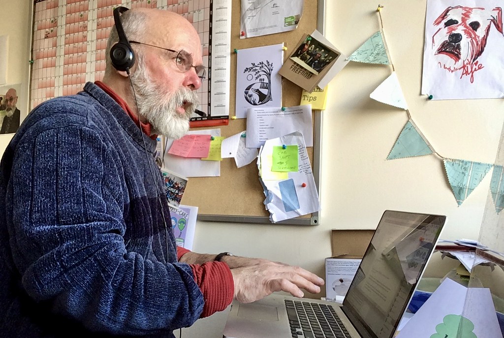 Man dictating with headset and computer