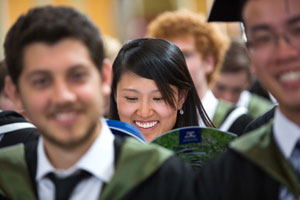 Students in uniforms smiling
