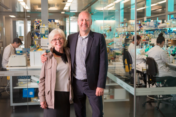 Image of Professor Doug Hilton with Pamela Galli in a lab.