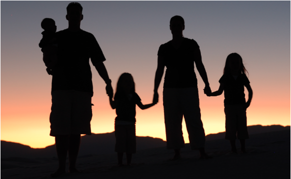 Silhouette of a family with children.