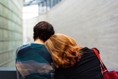 Women leaning on each other