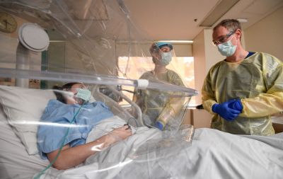 Image of ventilation hood with patient.
