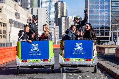 Students take a ride in bike cabs