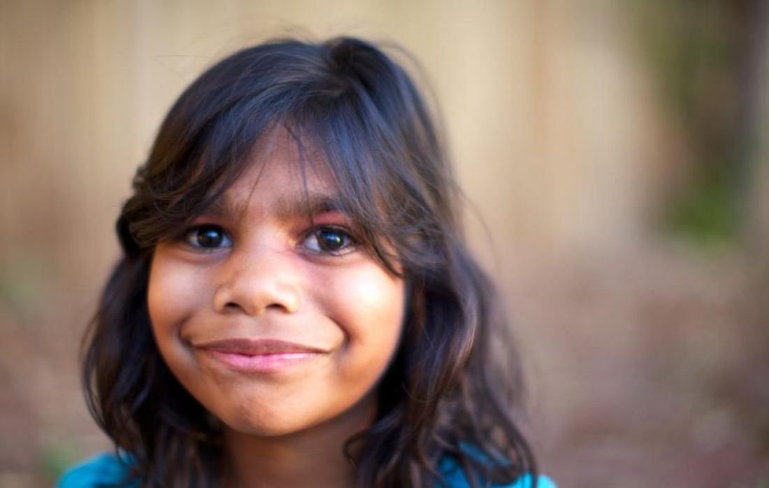 Young boy smiling at the camera