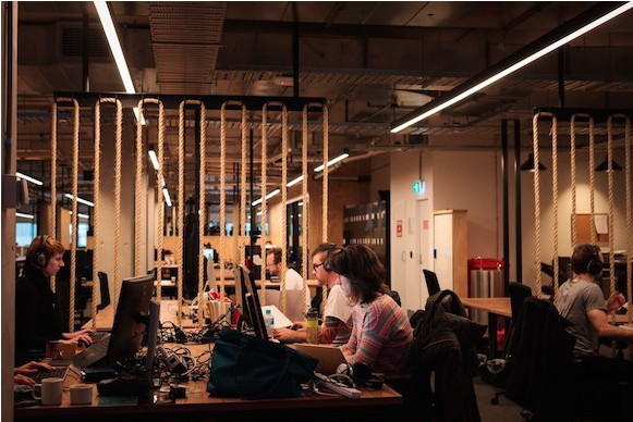 Image of ACMI X co-working space with people working at desks.