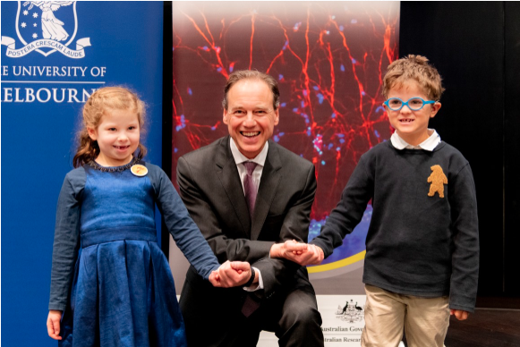 Image of Federal Minister for Health Greg Hunt pictured holding hands with Yve and Harry.