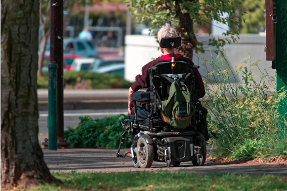 Image of a person with motor neurone disease in a wheelchair.