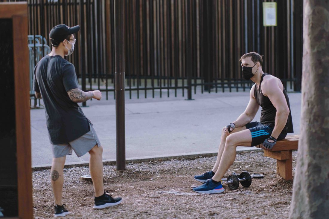 Two men social distancing in a park