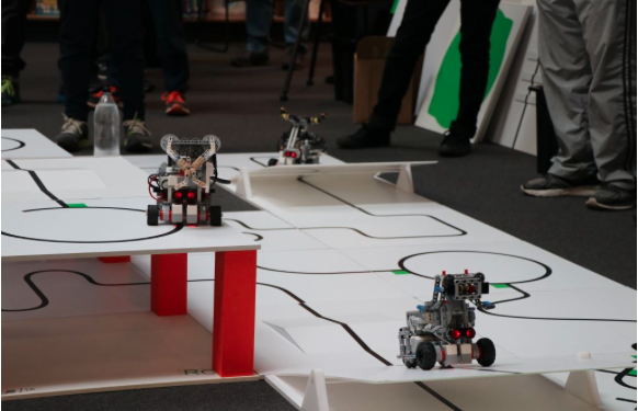 Image of small robotic machines at the RoboCup Junior State Finals.
