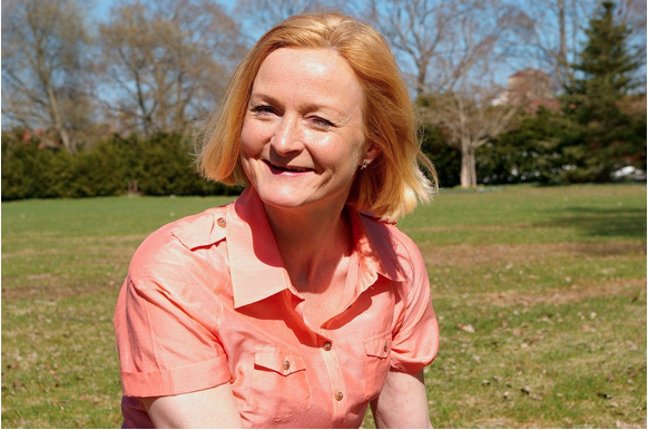 Image of smiling middle-aged lady.