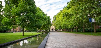 The Old Quad Building at the University of Melbourne with the South Lawn in the foreground.