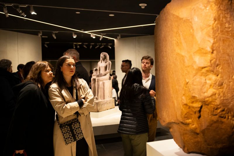 Alumni viewing the NGV's Pharaoh exhibition.