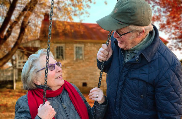 Elderly couple looking at each other