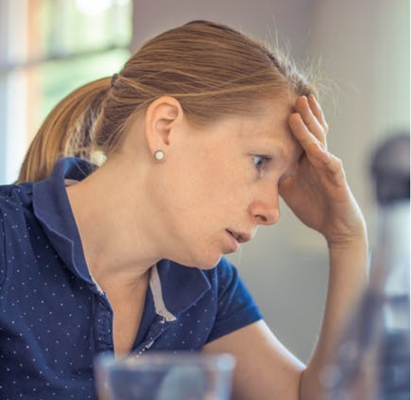 Image of a worried woman.