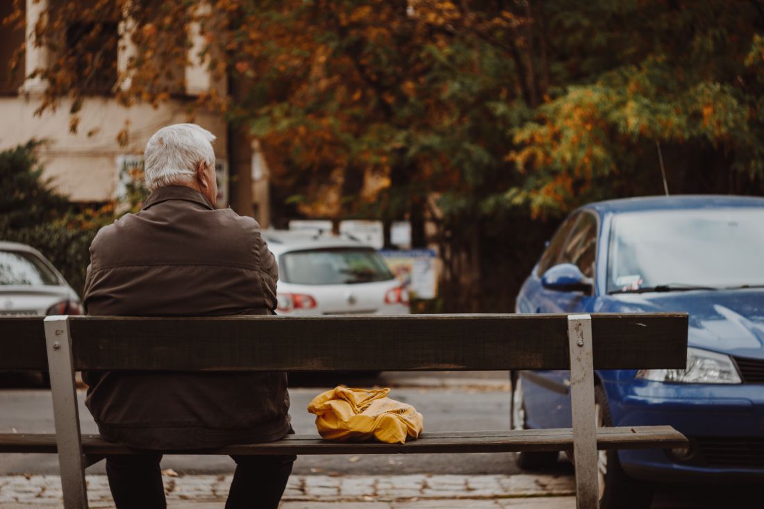 Older man sitting on a bench