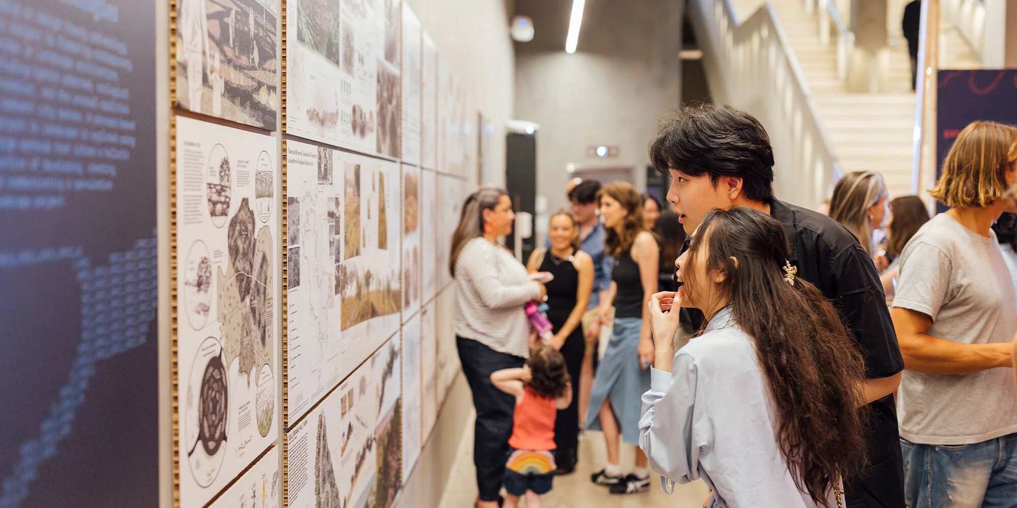 Two students looking at a poster 